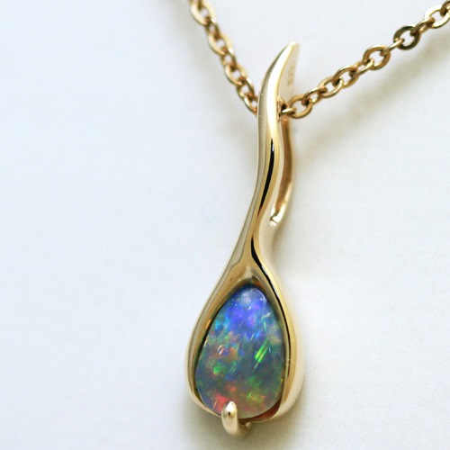 14k Yellow Gold Pendant with a SOLID SEMI BLACK OPAL Extreme fire, reds to blue, Jigsaw pattern